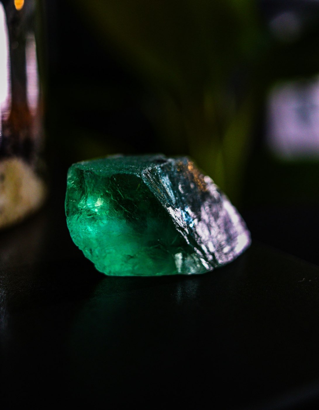 Rough green mineral crystal
