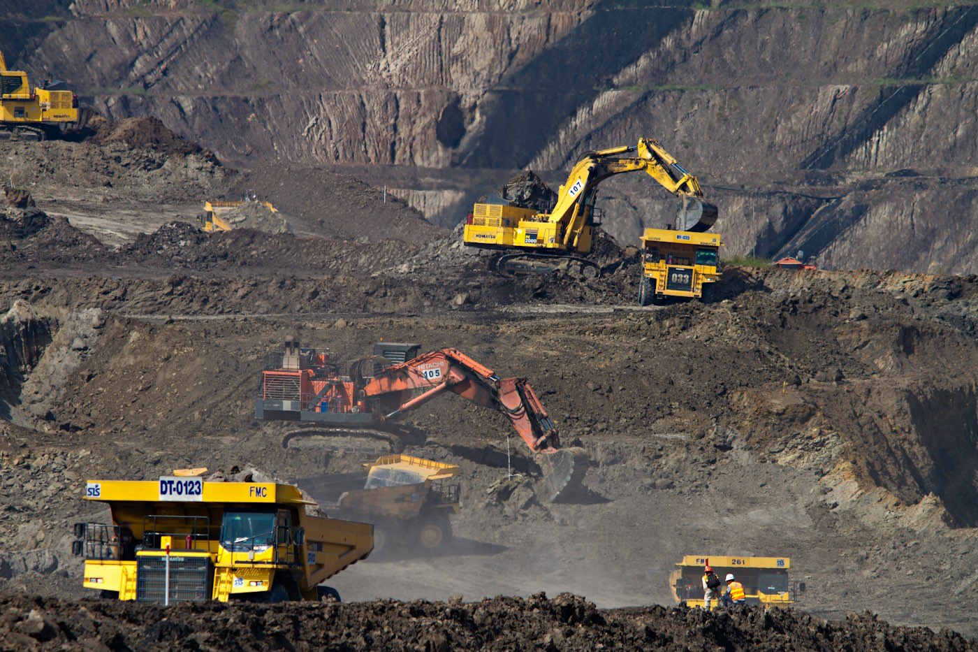Excavators and trucks at a mining site